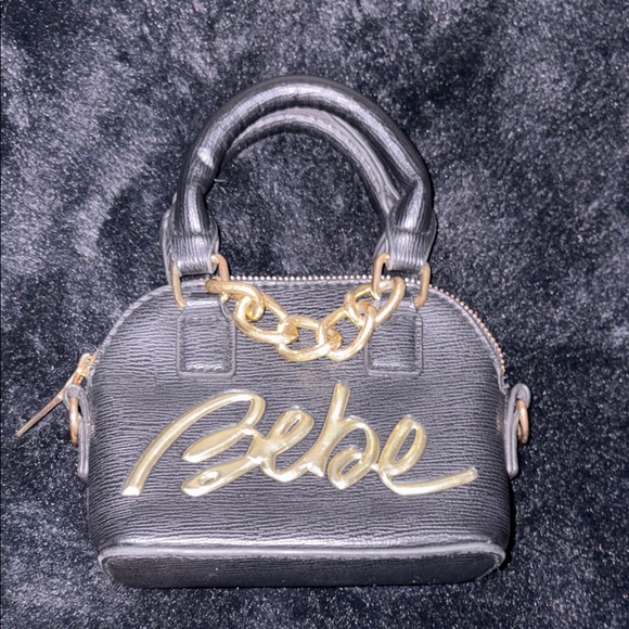 bebe Handbags - Bebe Black and Gold Mini Handbag